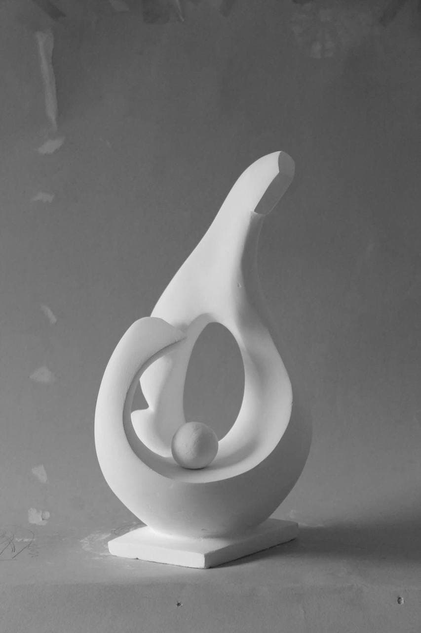 Cradle Form, full view against a studio wall