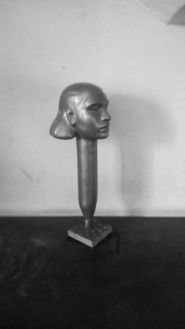 Head in Profile, full view on its stem and base