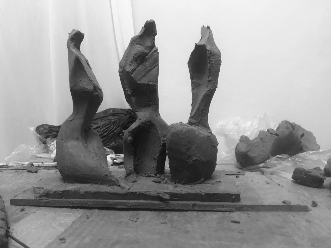 Three Figures, full view of the group on its shared base